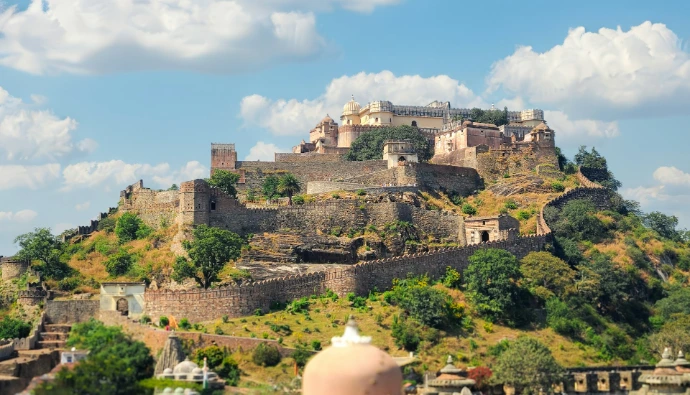 Ancient stone fortress perched on a lush green hill